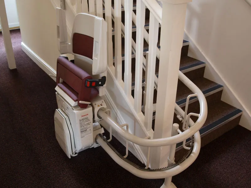 Stair lift at the foot of the stairs